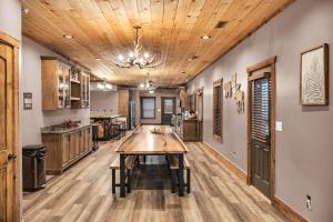 a kitchen with a wooden table in a room at Tellico River Retreat in Tellico Plains