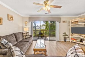 a living room with a couch and a ceiling fan at Baytree 28G in Little River