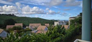 a view of a town with trees and buildings at Au zamana in Le Robert