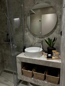 a bathroom with a sink and a mirror at Nido Estivo 1 in Nea Skioni +16 photos