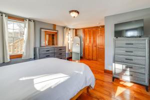 a bedroom with a bed and a tv and a dresser at Walk to Memorial Park: Pet-Friendly Bethlehem Home in Bethlehem