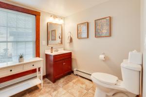 a bathroom with a toilet and a sink and a window at Walk to Memorial Park: Pet-Friendly Bethlehem Home in Bethlehem +17 photos