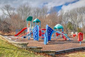 a playground in a park with a colorful slide at Walk to Memorial Park: Pet-Friendly Bethlehem Home in Bethlehem
