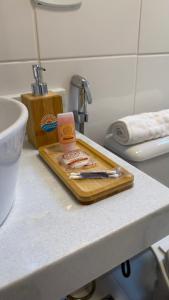 a cutting board with some food on a counter at Pousada Mar da Vila in Cabo Frio