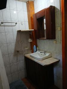 a bathroom with a sink and a mirror at Casa Sureña en Ensenada in La Ensenada +28 photos
