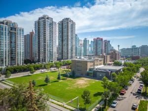 an aerial view of a city with tall buildings at Contemporary, cozy & easy to Rocky Mountains from Calgary ! in Calgary