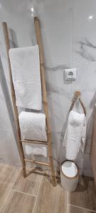 a bathroom with a towel rack and a toilet at Le Cocon des Vignes in Vidauban +5 photos