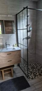 a bathroom with a shower and a sink at Duplex escape in Quartier Palmène