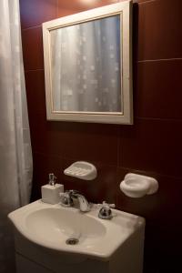 a bathroom with a white sink and a mirror at Finca La Tranquerita in San Rafael +35 photos