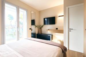 a bedroom with a large bed and a window at A la plage R in San Benedetto del Tronto