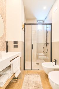 a bathroom with a shower and a toilet and a sink at A la plage R in San Benedetto del Tronto +23 photos