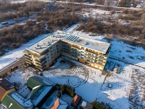 an aerial view of a building in the snow at Eternity Apartment in Štúrovo