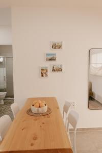 a dining room table with a bowl of eggs on it at אירוח משק 42 in Sheʼar Yashuv +27 photos