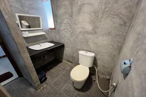 a bathroom with a toilet and a sink at Rabiangmai Resort in Ban Ko Krang +79 photos