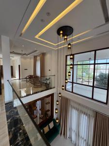 a living room with a staircase in a house at Ferien Villa in Kalutara