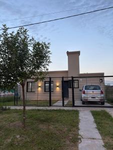 a white van parked in front of a building at Casa Serena in Capitán Bermúdez