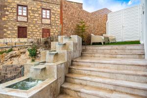 a set of stairs leading up to a building at AC Encanto in La Cisnera