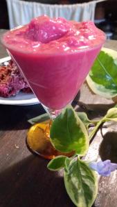 a pink drink sitting on top of a wooden table at Nuevo Ciclo in Tigre +19 photos