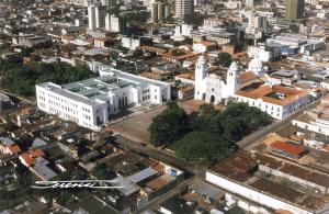 an overhead view of a large white building in a city at Hostal San Francisco in San Cristóbal