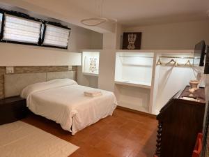 a bedroom with a white bed and a window at B&B Luxury in Lecce