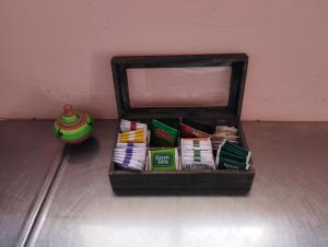 a wooden box filled with different types of snacks at Rincones de la Puna in Antofagasta de la Sierra +4 photos