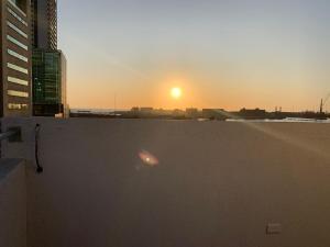 a view of the sunset from a building at Éclat Hotel Boutique in Iquique