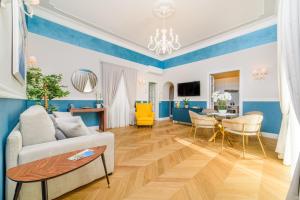 a living room with a couch and a table at Sirenuse Home & Suites in Sorrento