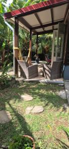 a group of chairs sitting under a gazebo at Duplex escape in Quartier Palmène +8 photos