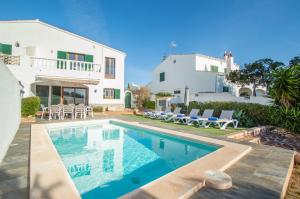 a villa with a swimming pool and a house at Villa Can Canaleta by Sonne Villas in Cala Galdana