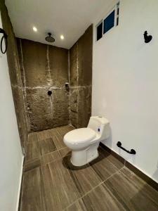 a bathroom with a white toilet in a room at SUNSET BEACH in Playa Blanca +117 photos