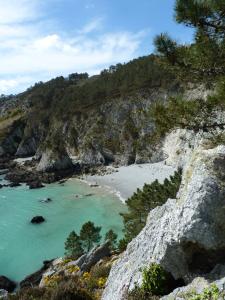 a view of a beach with people in the water at Ty Bihan de L'Aber in Crozon