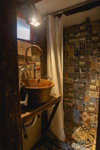 a bathroom with a sink and a shower at Narakan Cabo Polonio in Cabo Polonio +111 photos