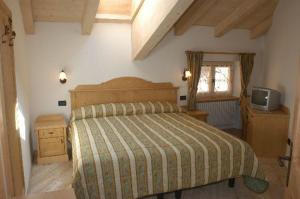A bed or beds in a room at Residence Ca' Delle Margherite Még 37 kép