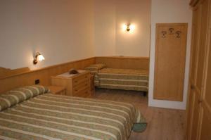 A bed or beds in a room at Residence Ca' Delle Margherite