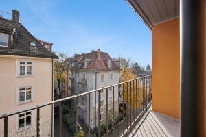 a balcony with a view of some buildings at Very centrally located studio - Crown 15 in Zurich