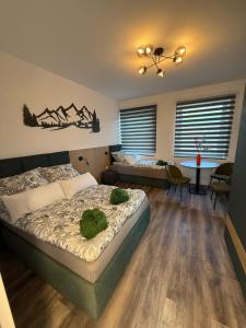 a bedroom with a bed and a table and chairs at Studio-Apartament 101 free Parking Domus Kushal in Viersen