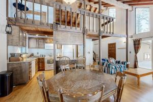 a kitchen and living room with a table and chairs at < 2 Mi to Tahoe Donner Ski Resort: Serene Retreat in Armstrong