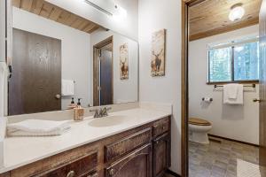 a bathroom with a sink and a toilet at < 2 Mi to Tahoe Donner Ski Resort: Serene Retreat in Armstrong +19 photos