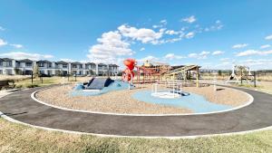 a park with a playground with a slide at Lyra 2026 Home by GoodLive in Beveridge