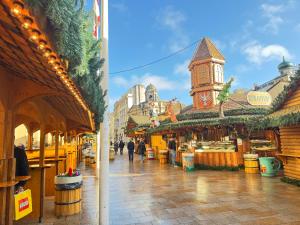 a market with people walking down a street at Homi Host- Monthly stay in Birmingham