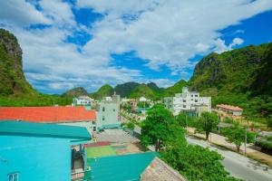 a view of a town with mountains in the background at Mountain View Hostel in Bố Trạch
