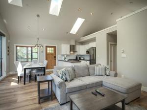 a living room with a couch and a table at Oceanfront & Amazing Views - Pet Friendly - 2bdrm in Port Renfrew +20 photos