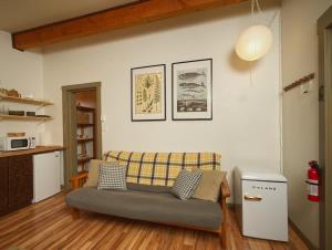 a living room with a couch and a table at The Rocky Knoll - Garden View - Pet Friendly in Port Renfrew