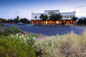 a front view of a hotel with a parking lot at Wildcatter Ranch and Resort in Graham
