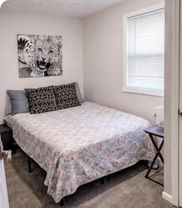 a bedroom with a bed and a window at Cozy Small Private Room 3 on McDaniel Street in Atlanta