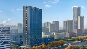 a tall glass building in a large city at Four Points by Sheraton Hefei High-Tech Zone in Hefei