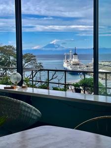a view of a cruise ship in the ocean at Hotel MOANA絶景オーシャンビューカフェラウンジ朝食付き in Oshima +42 photos