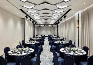 a banquet hall with tables and chairs in a room at Hotel HLB in Busan +55 photos