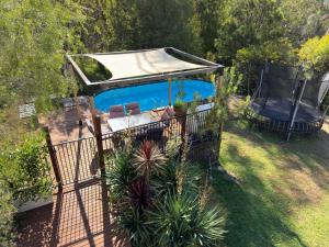 an overhead view of a house with a swimming pool at Tatra Studio Bright - Relax & Explore in Bright
