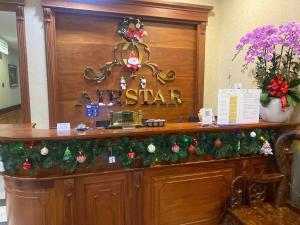 a hotel lobby with christmas decorations on a counter at Air Star Hotel in Ho Chi Minh City
